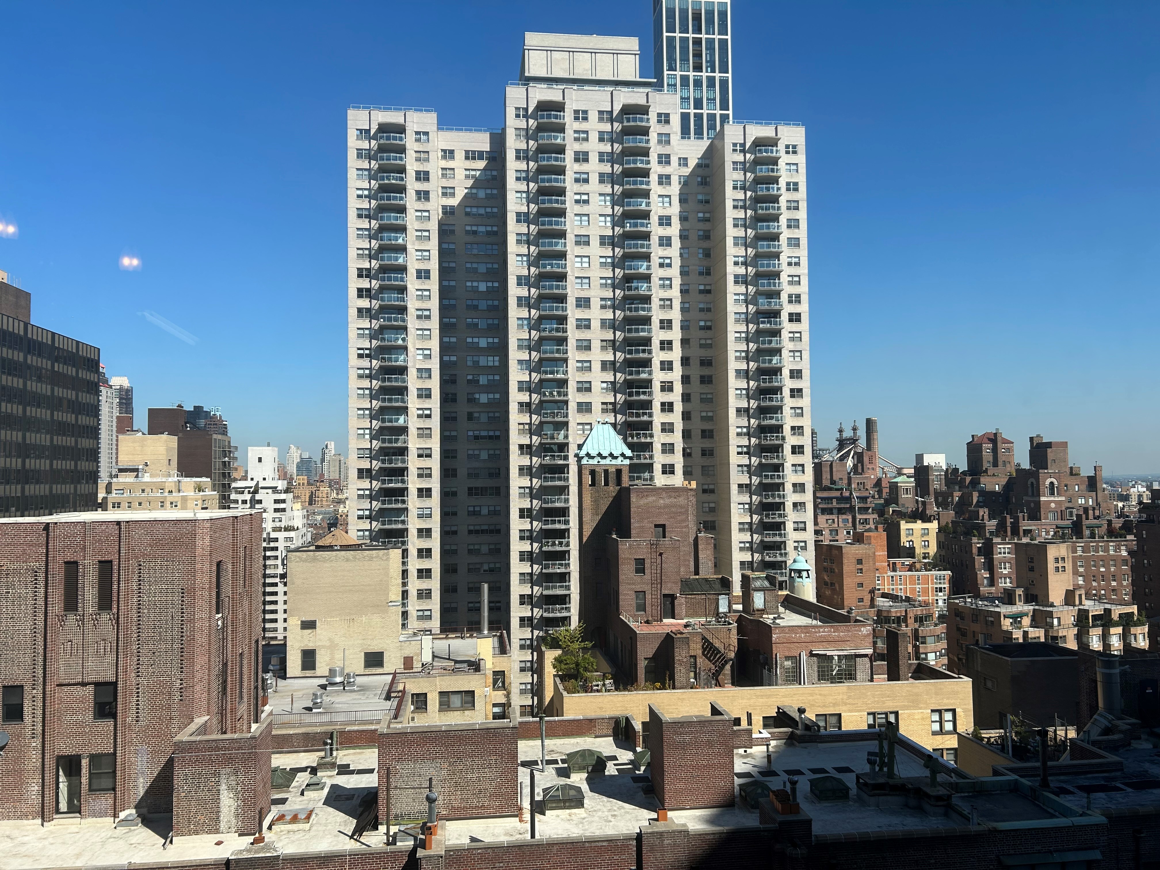 400 East 54th Street, Unit 24E Manhattan, NY 10022 - Photo 19 of 29 a view of a city with tall buildings