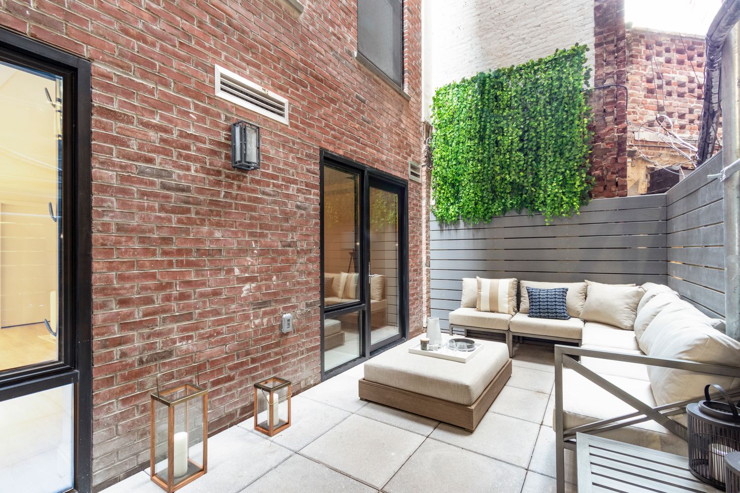 106 Franklin Street, Unit MAIS Manhattan, NY 10013 - Photo 5 of 16 a view of a patio with couches and potted plants