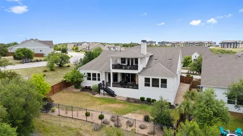 an aerial view of a house with a garden and plants