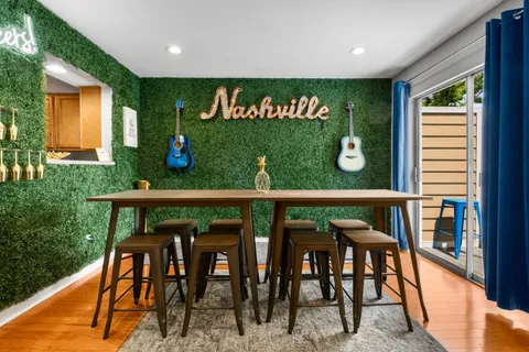 a view of a chairs and table in kitchen