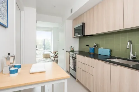 a kitchen with stainless steel appliances granite countertop a sink and cabinets