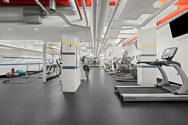70 East 10th Street, Unit 14M Manhattan, NY 10003 - Photo 19 of 22 a view of a room with gym equipment