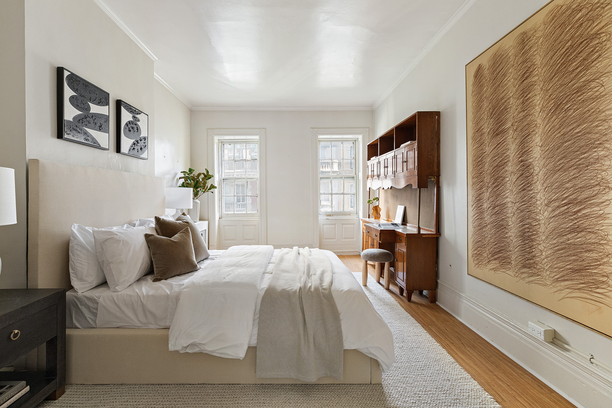 10 East 82nd Street Manhattan, NY 10028 - Photo 15 of 22 a bedroom with a bed and wooden floor