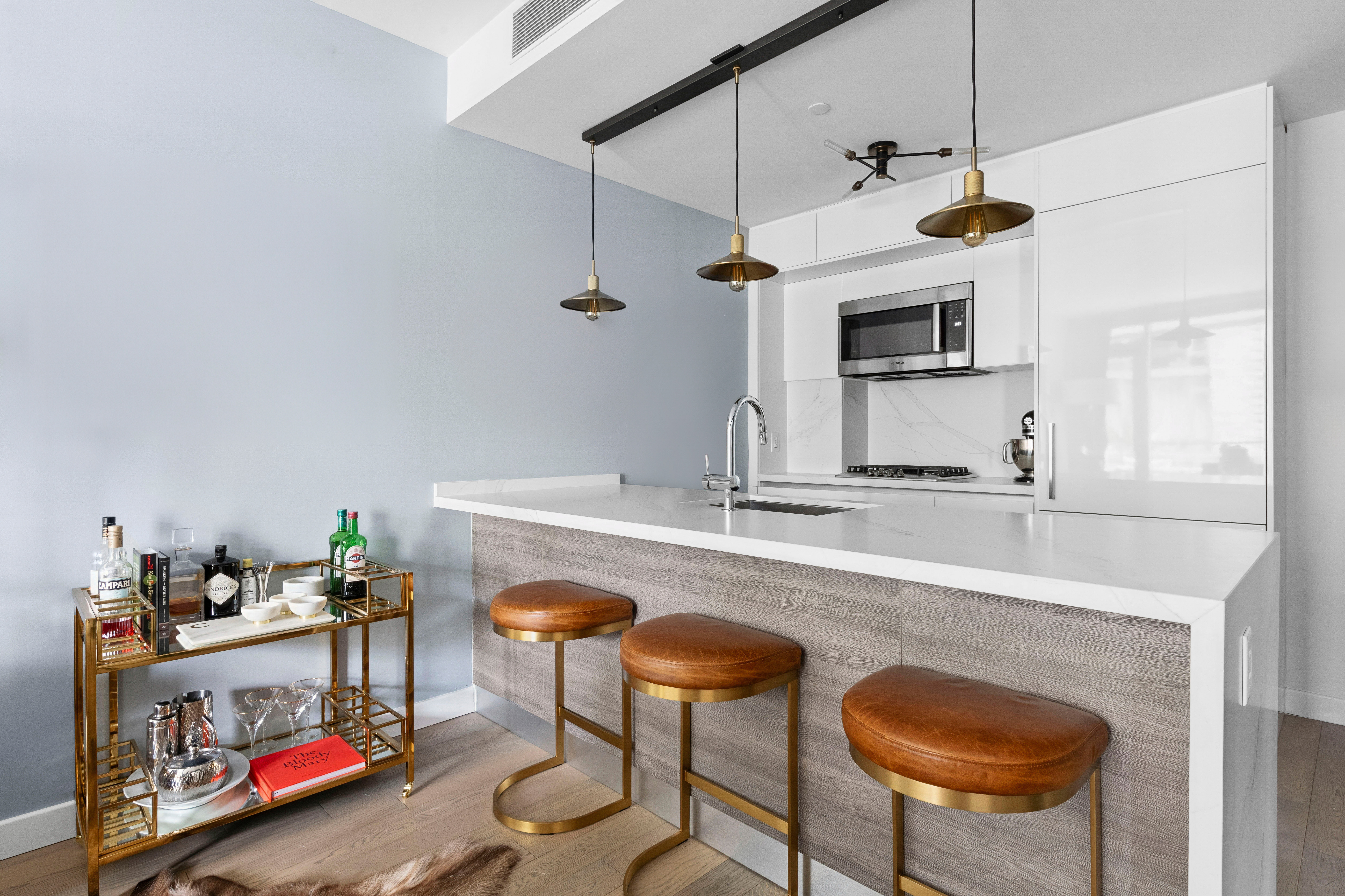 505-513 West 43rd Street, Unit 6K Manhattan, NY 10036 - Photo 3 of 16 a kitchen with stainless steel appliances granite countertop a sink and a refrigerator