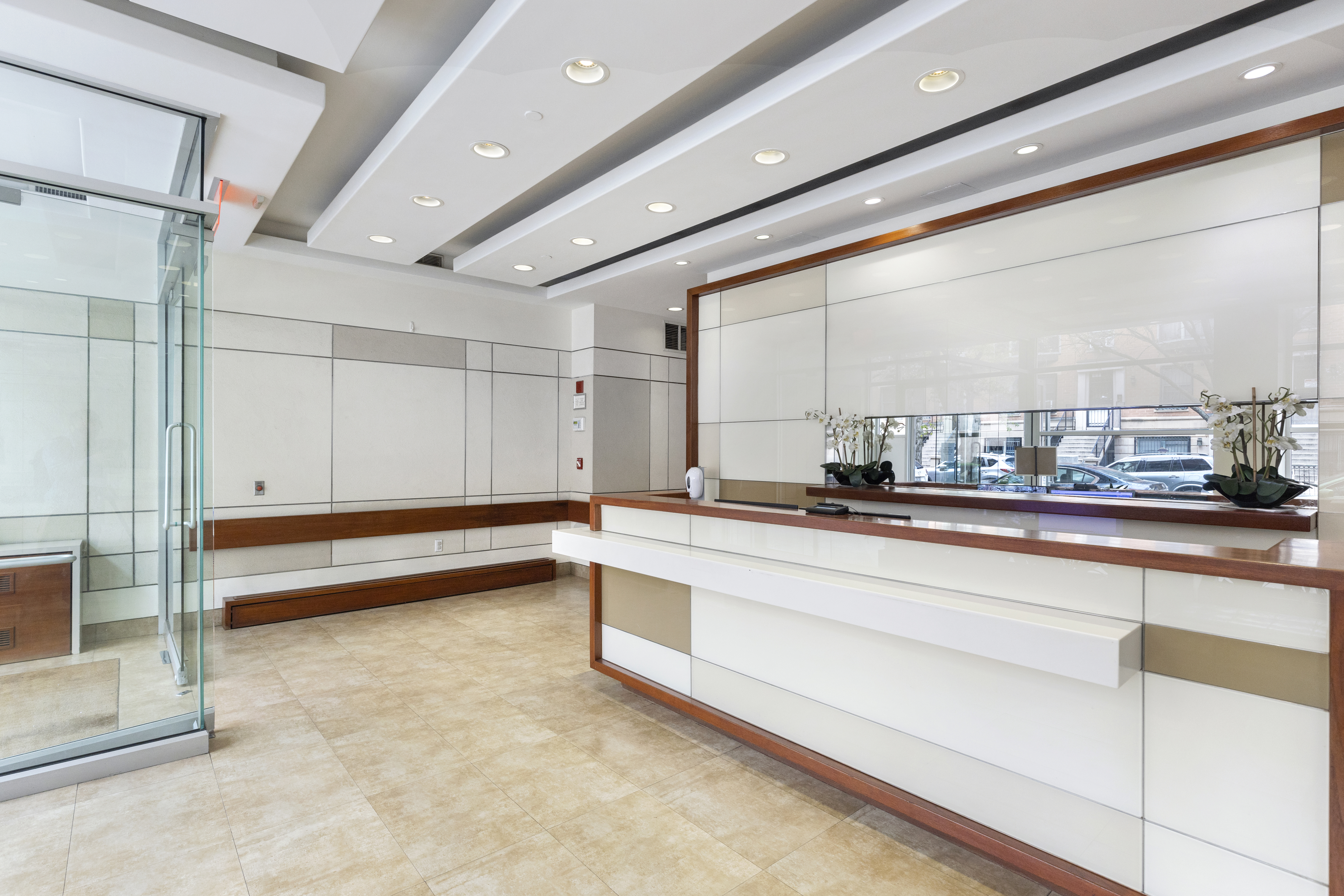 313 West 119th Street, Unit PHE Manhattan, NY 10027 - Photo 15 of 19 a large white kitchen with a large window and furniture