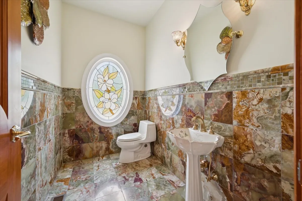 a bathroom with a toilet and a sink