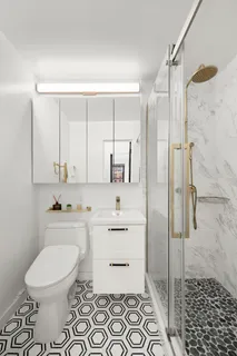 a bathroom with a sink toilet and shower