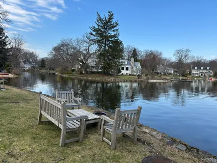 a lake view with a table and chairs