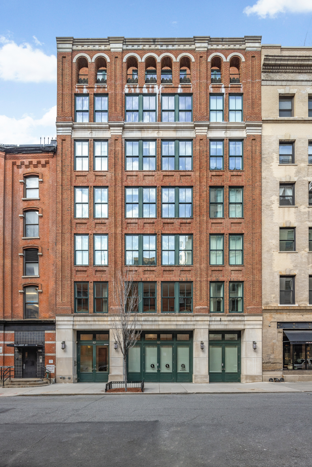 52 Laight Street, Unit R2 Manhattan, NY 10013 - Photo 20 of 21 a front view of a building with glass windows