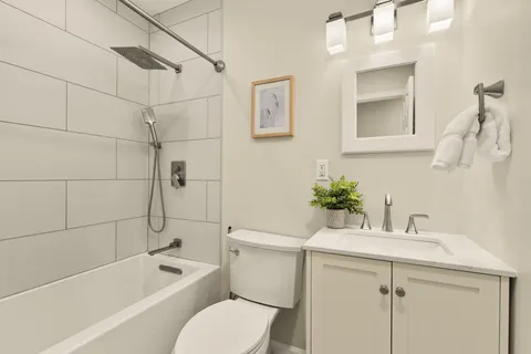 a bathroom with a toilet and shower