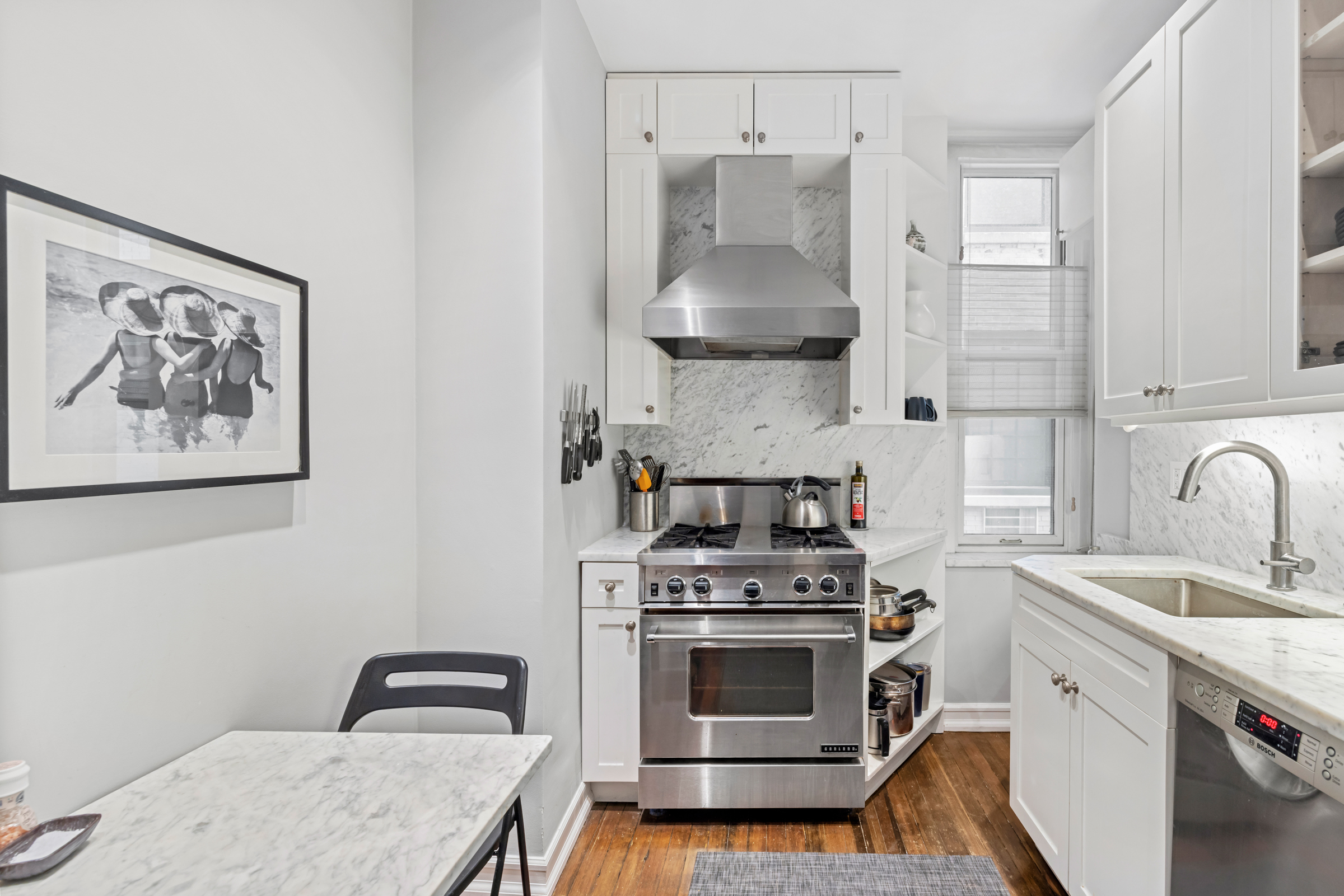 50 West 67th Street, Unit 5F Manhattan, NY 10023 - Photo 5 of 13 a kitchen with a stove and a sink