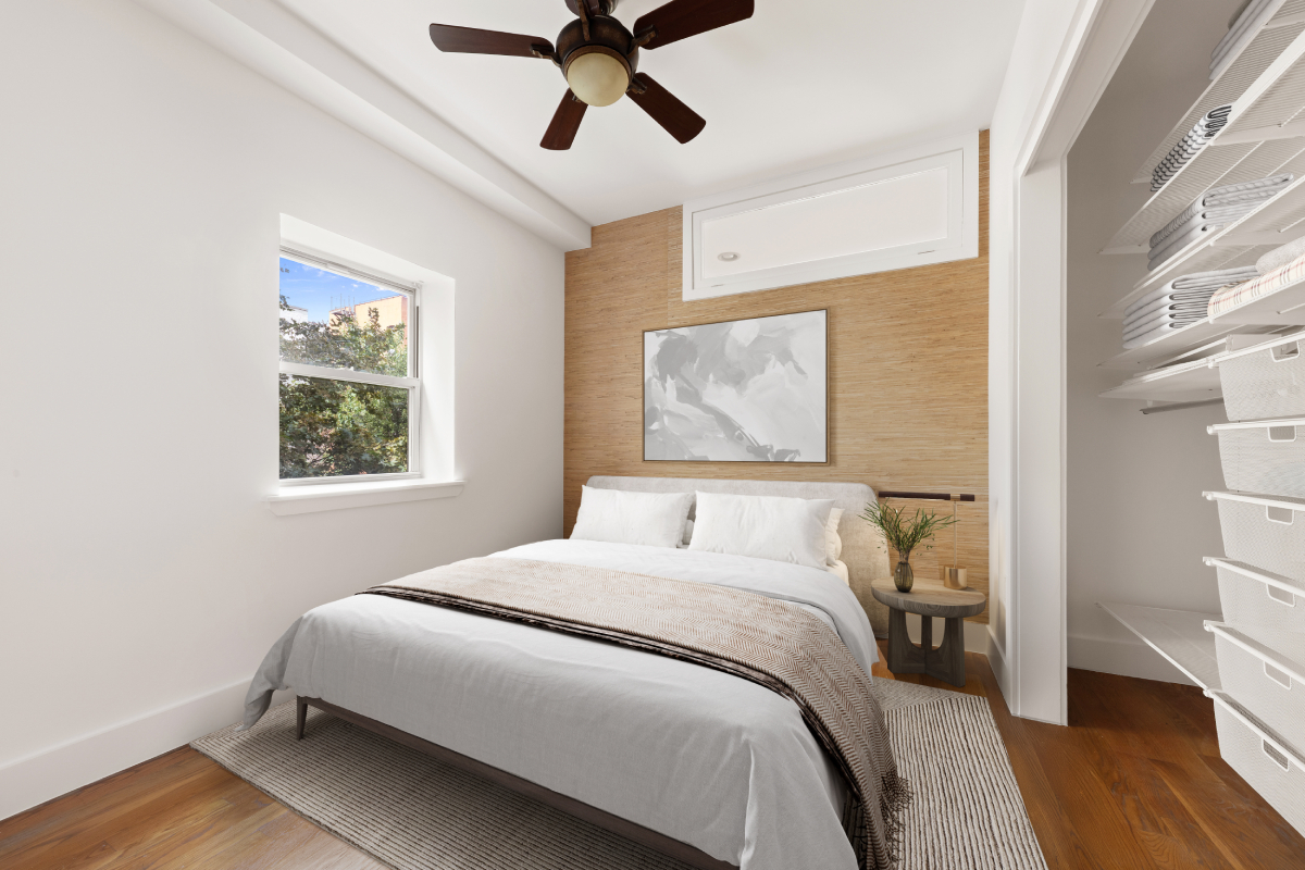 221 West 148th Street, Unit 4B Manhattan, NY 10039 - Photo 3 of 10 a bedroom with a bed and wooden floor