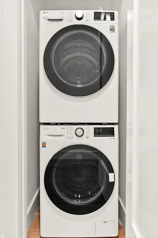 88 5th Avenue, Unit 4L Brooklyn, NY 11217 - Photo 5 of 5 a utility room with dryer and washer