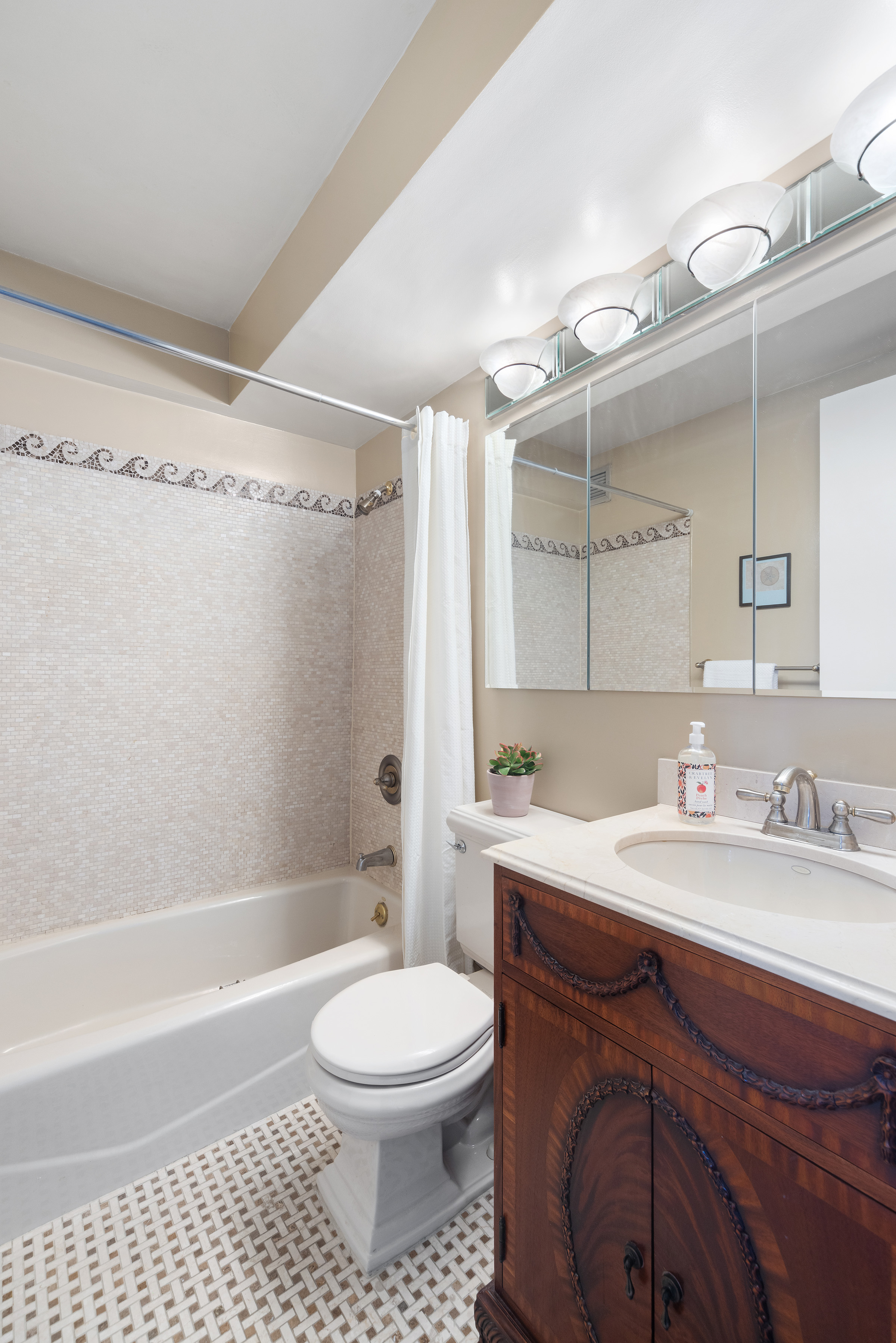 233 East 86th Street, Unit PHB Manhattan, NY 10028 - Photo 9 of 12 a bathroom with a sink a toilet and shower