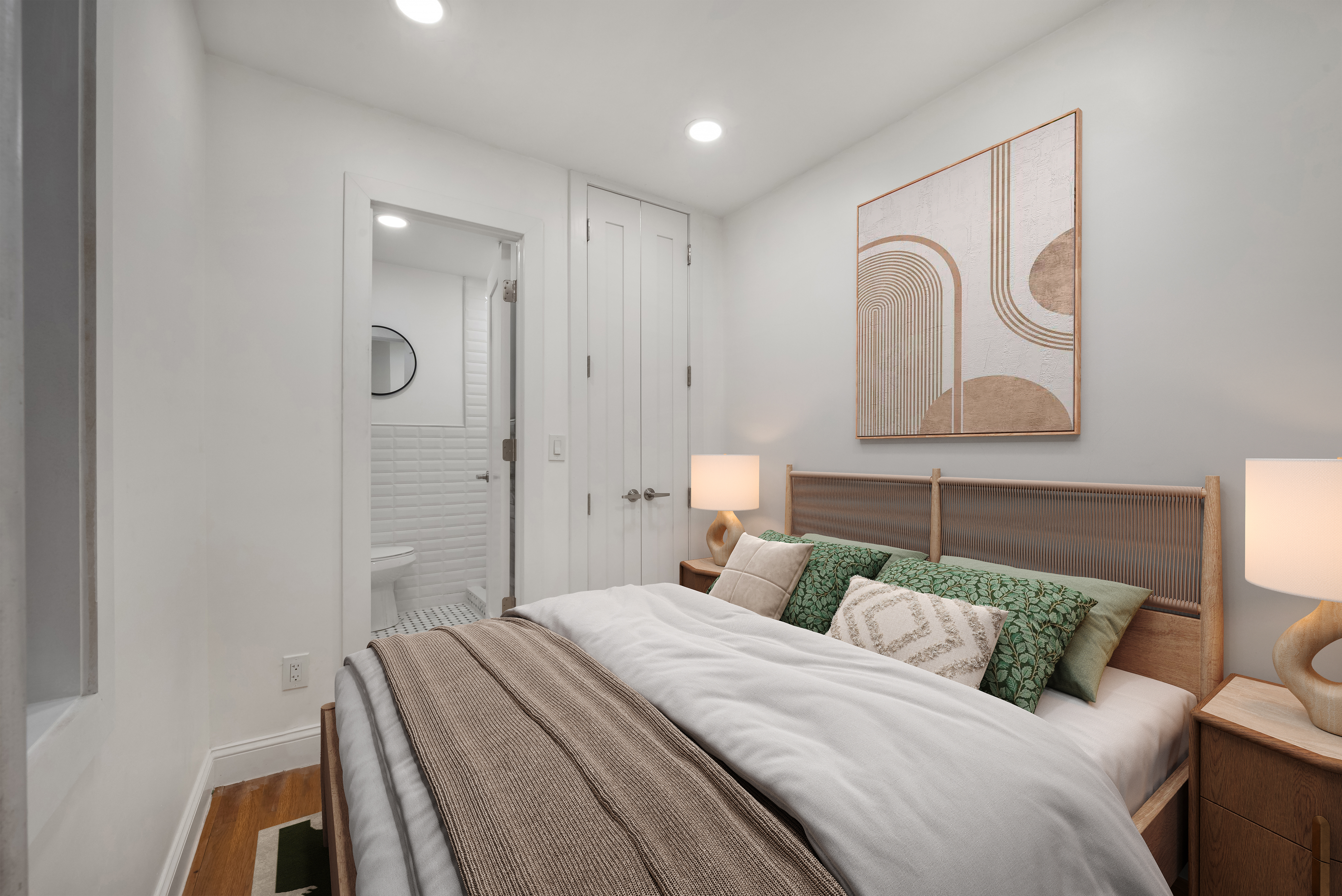 317 East 73rd Street, Unit 4RE Manhattan, NY 10021 - Photo 4 of 8 a bedroom with a bed and a potted plant