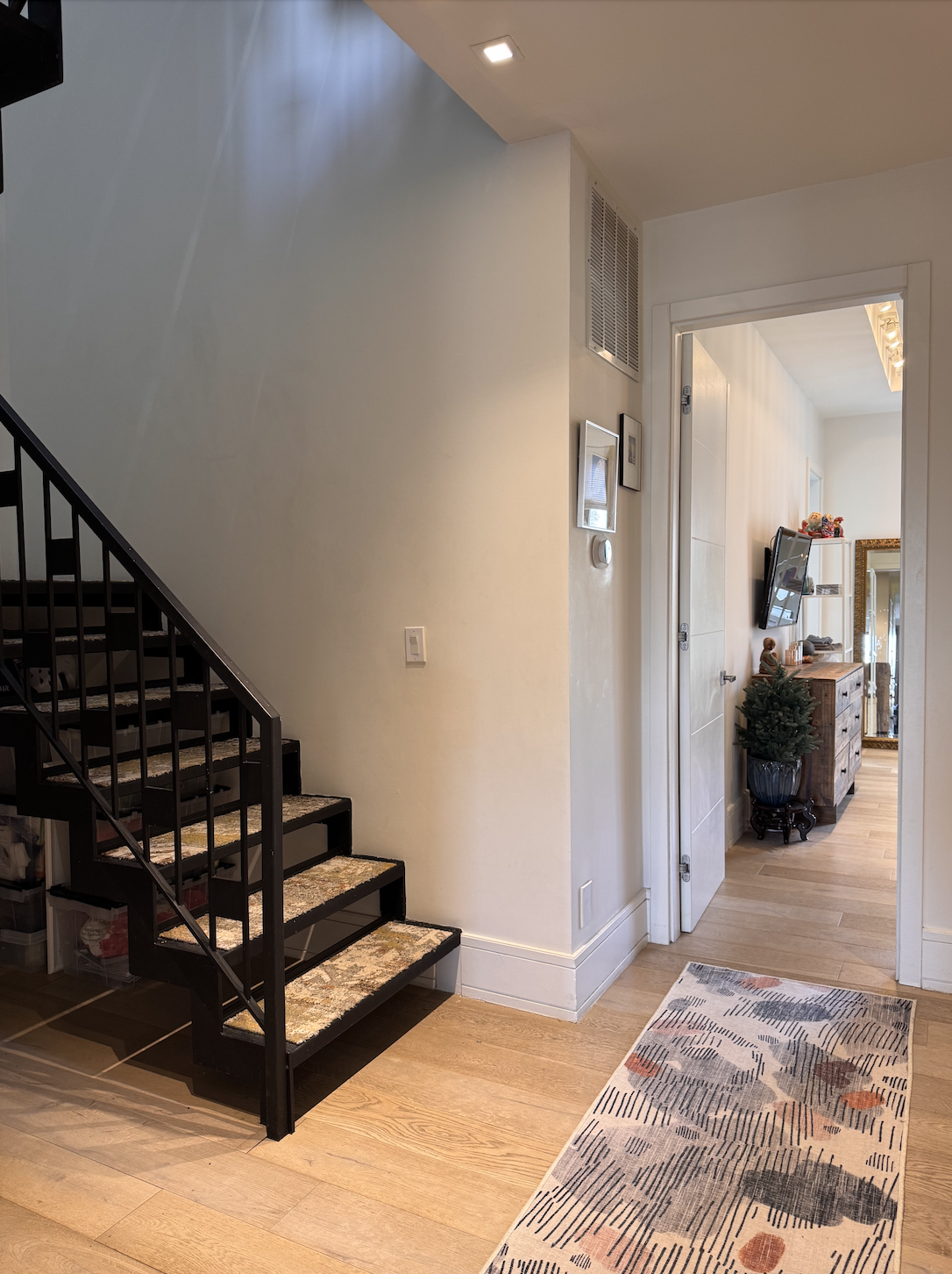 288 19th Street, Unit 3 Brooklyn, NY 11215 - Photo 7 of 26 a view of a bedroom with wooden floor and a bathroom