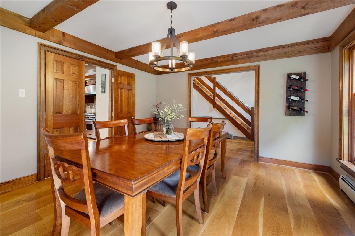 a bathroom with a mirror sink and glass door