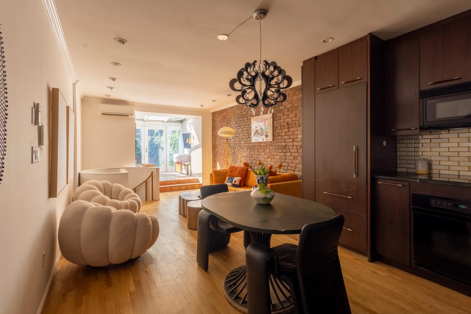 a view of a dining room with furniture window and wooden floor