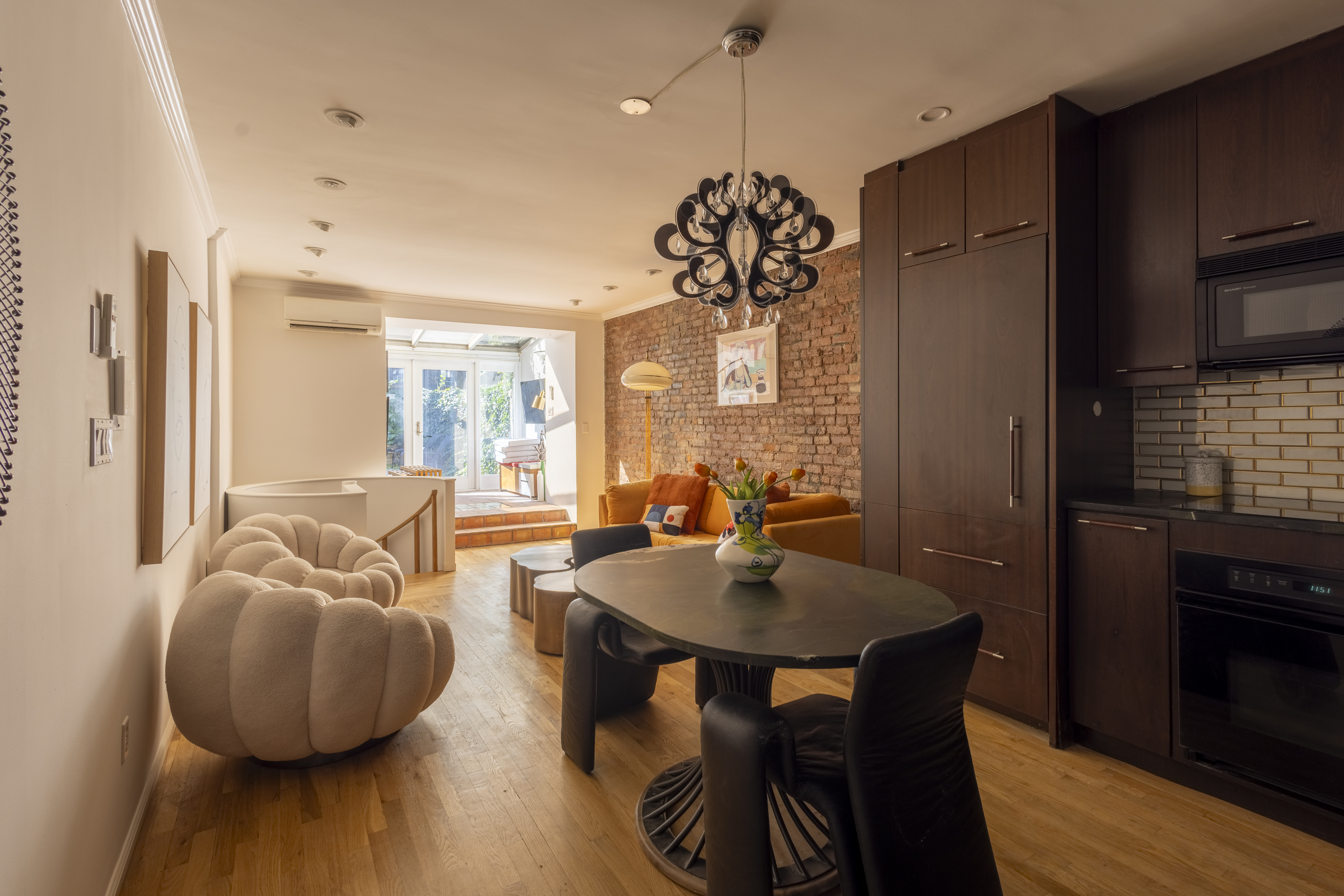 a view of a dining room with furniture window and wooden floor