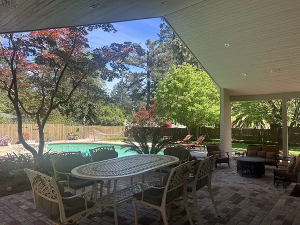 a view of a balcony with wooden floor