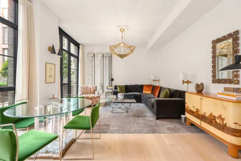 a living room with furniture and a table