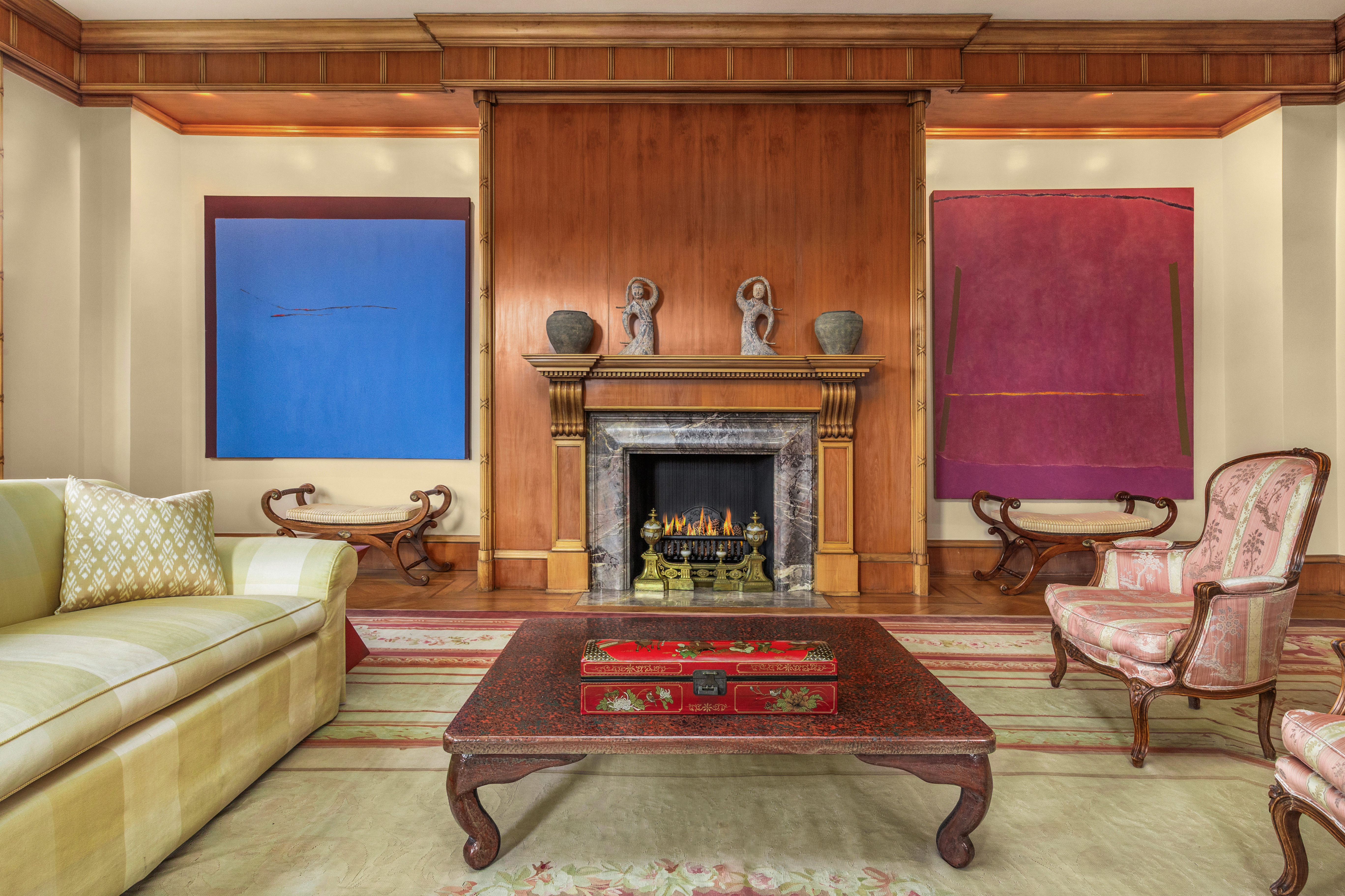 990 5th Avenue, Unit 4/5 Manhattan, NY 10075 - Photo 2 of 18 a living room with furniture and a fireplace