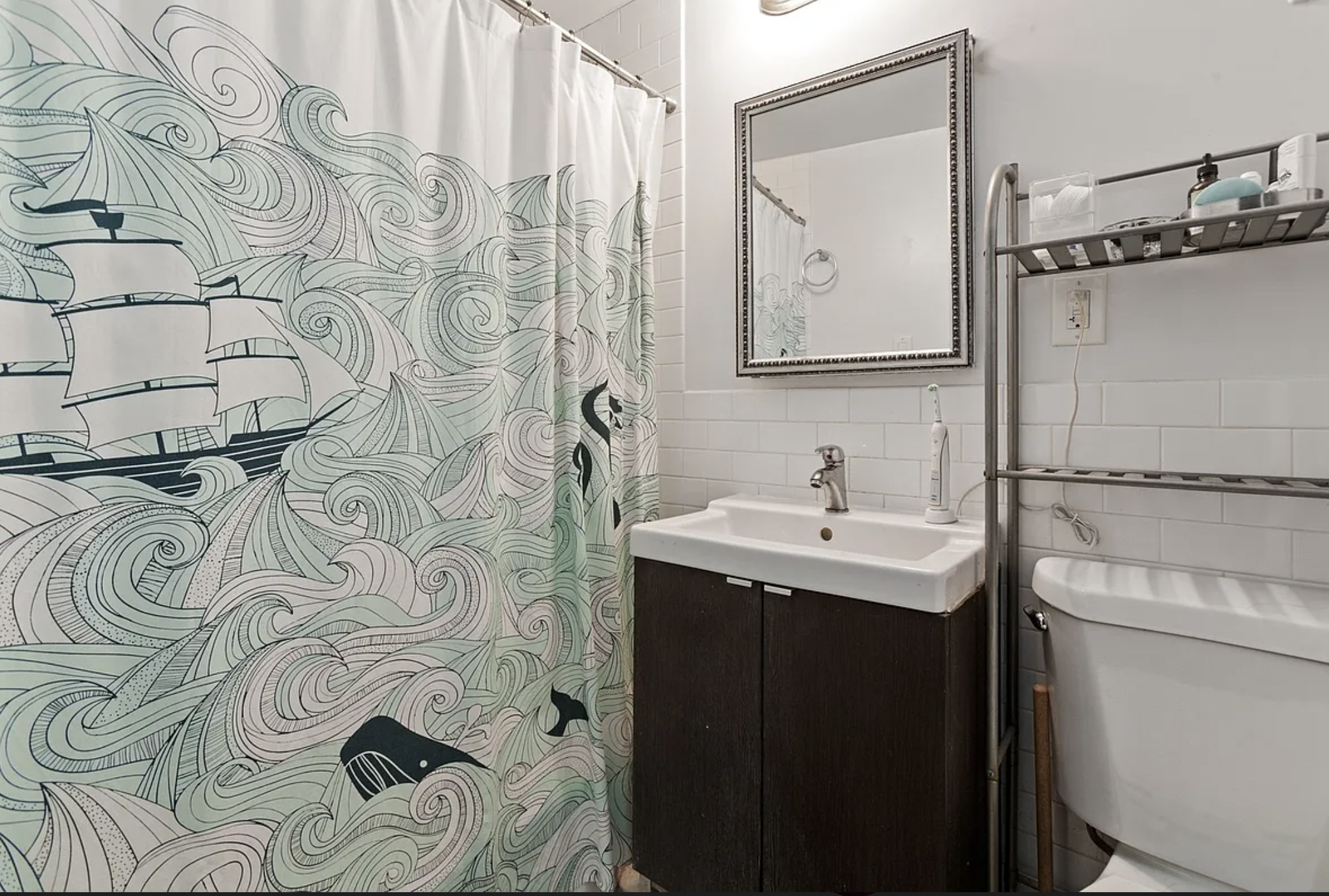 54 Orange Street, Unit 4D Brooklyn, NY 11201 - Photo 4 of 10 a bathroom with a sink and a mirror