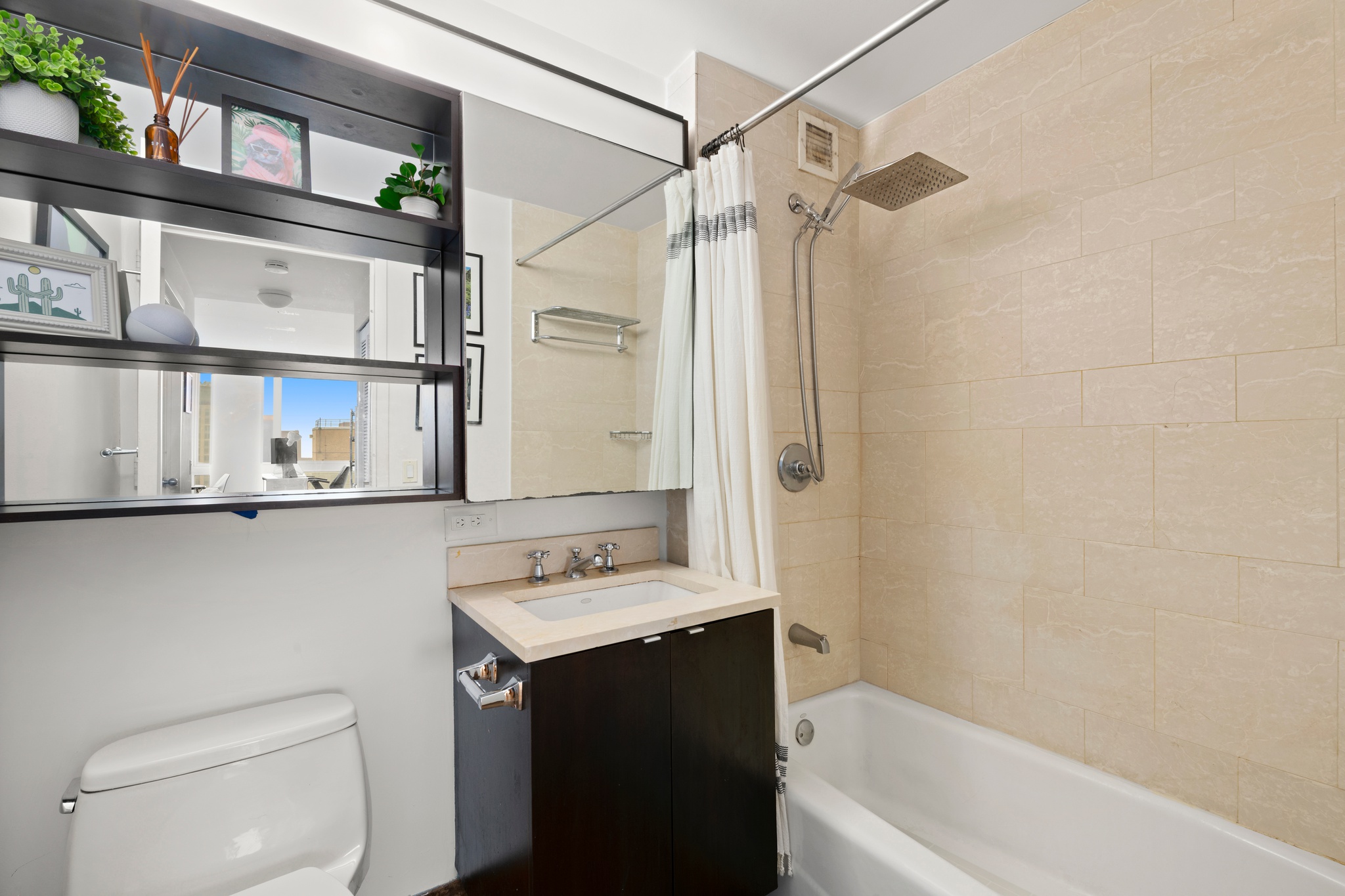 215-217 East 96th Street, Unit 40E Manhattan, NY 10128 - Photo 3 of 7 a bathroom with a sink a toilet and shower