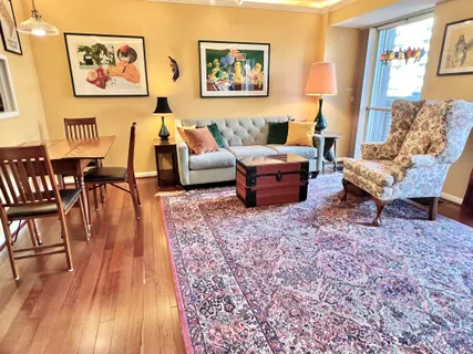 a living room with furniture or couch and a lamp