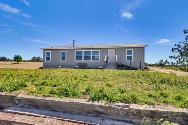 a view of an ocean beach and mountain