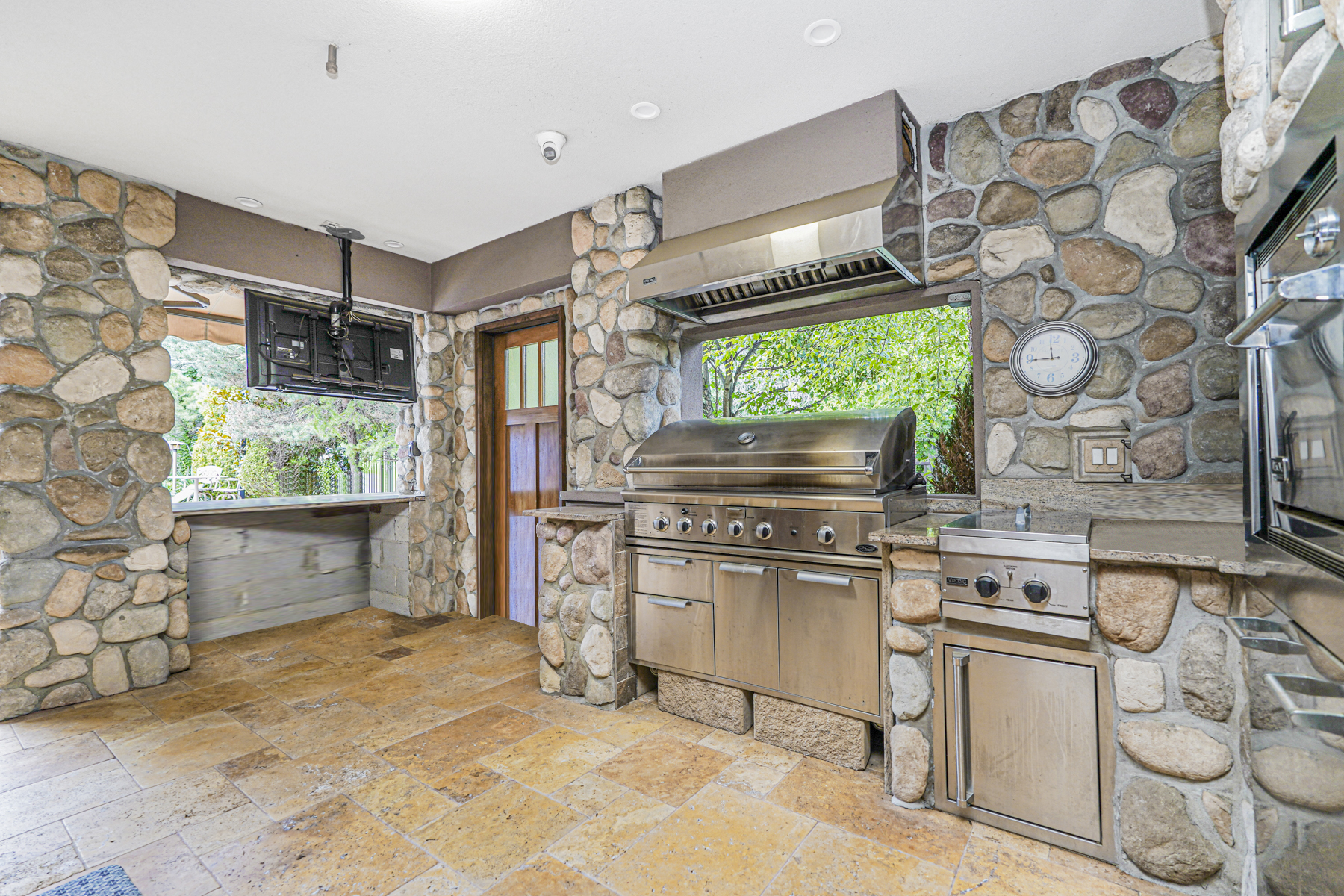 165 Swaim Avenue Staten Island, NY 10312 - Photo 27 of 45 a kitchen with stainless steel appliances granite countertop a stove a sink and a microwave