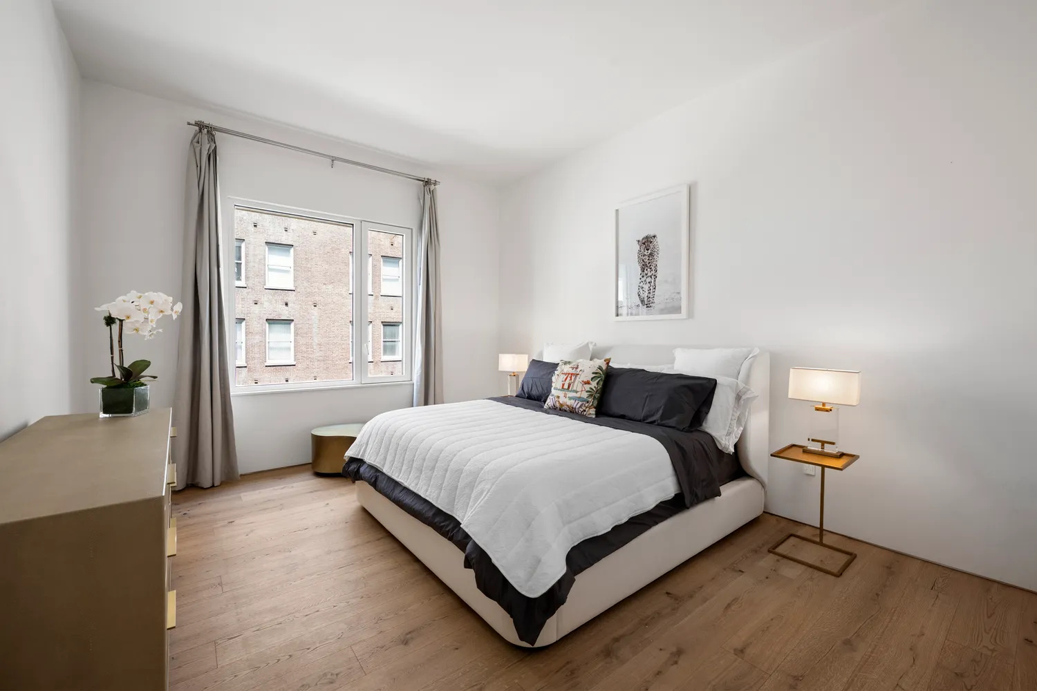 a bedroom with a bed lamp and window