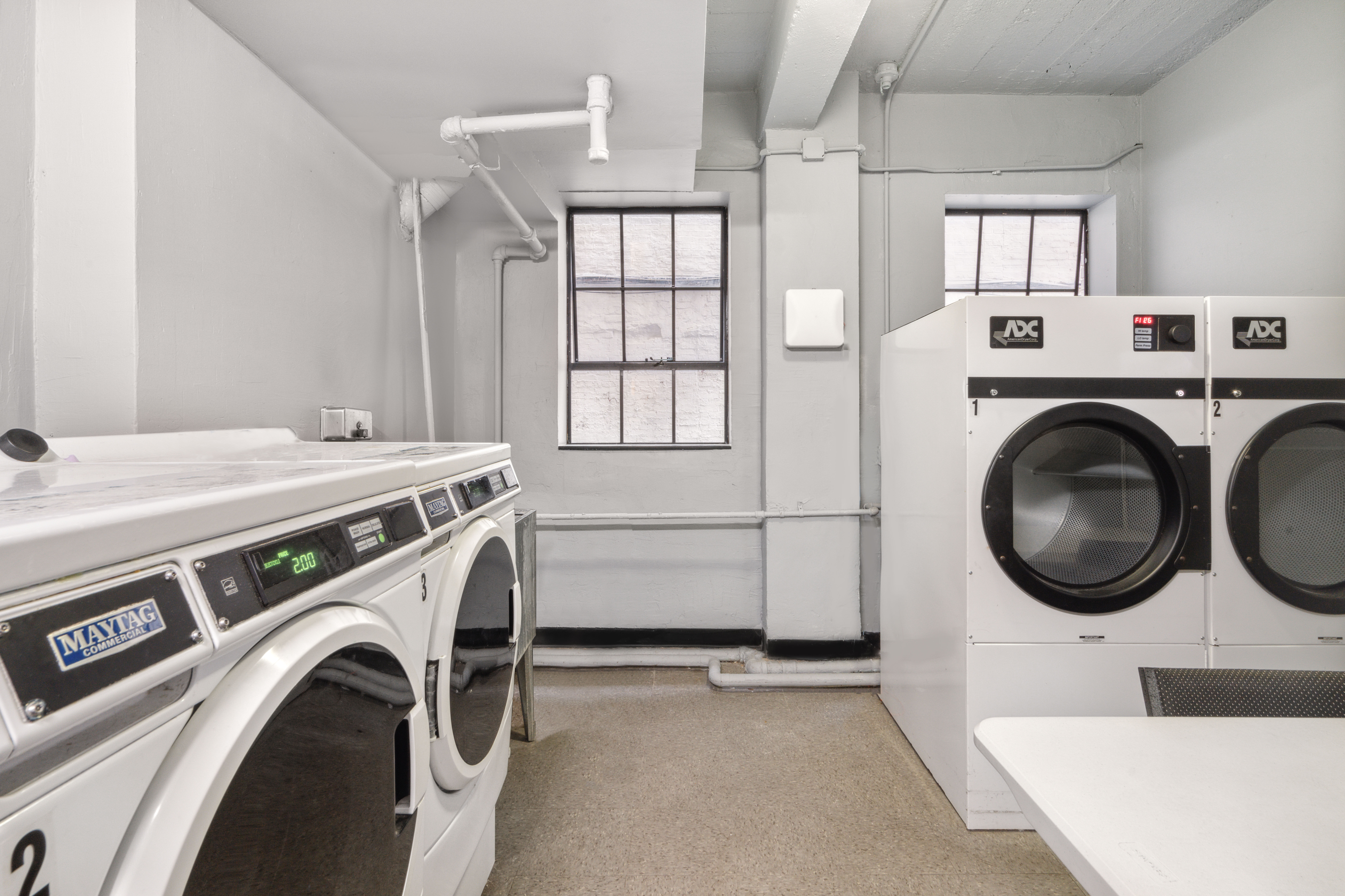 25 Monroe Place, Unit 1C Brooklyn, NY 11201 - Photo 9 of 14 a utility room with dryer and washer