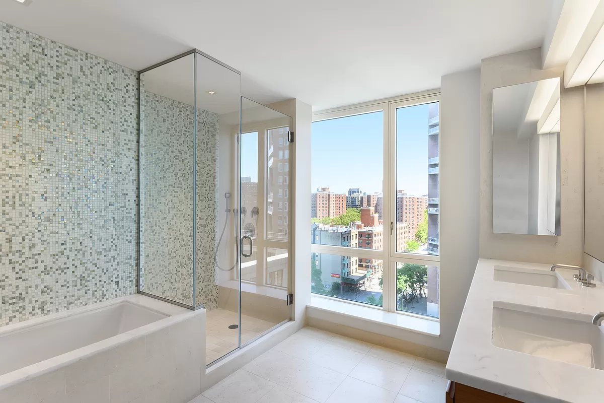 1280 5th Avenue, Unit 10A Manhattan, NY 10029 - Photo 6 of 15 a bathroom with a tub sink and shower