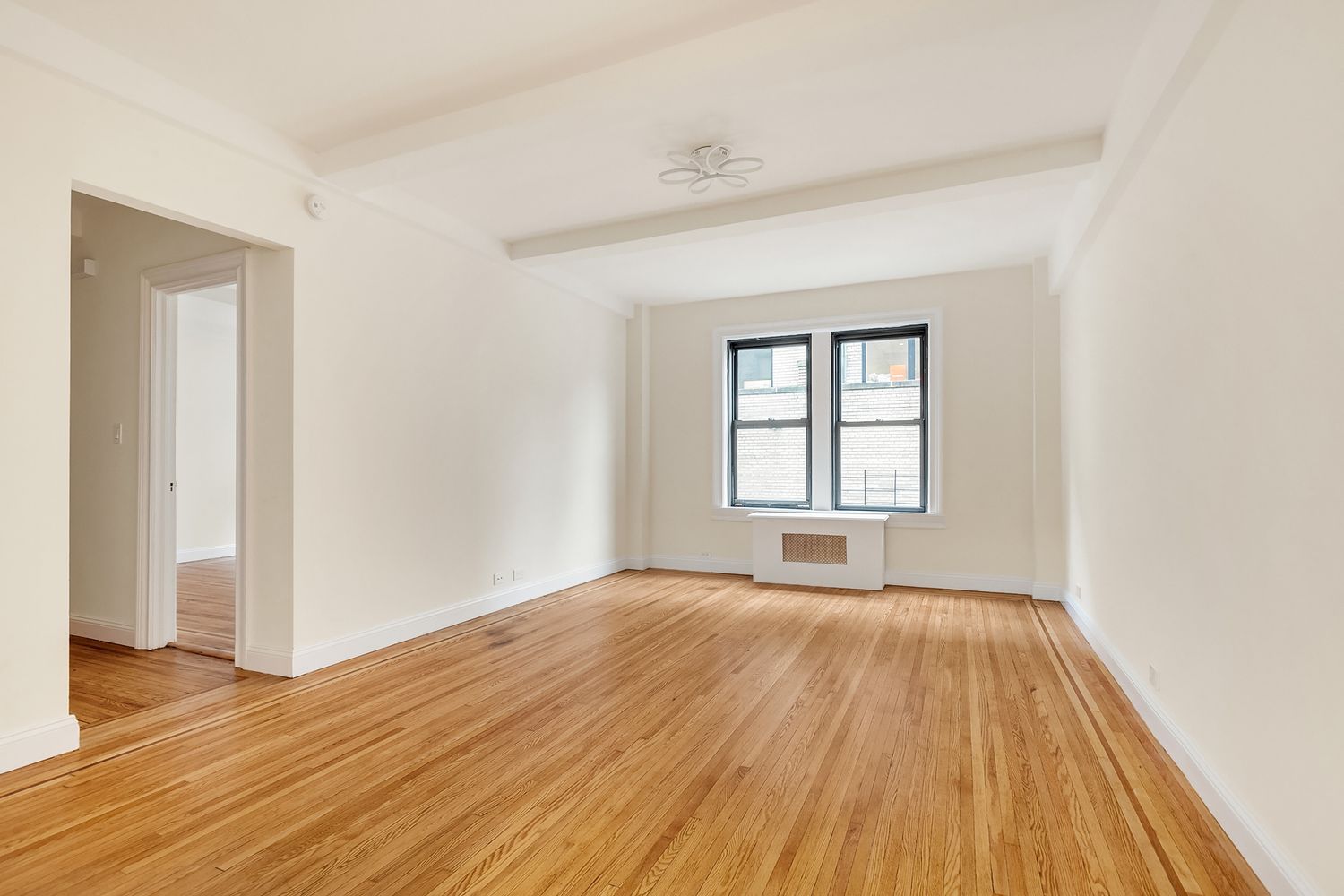 20 West 84th Street, Unit 3A Manhattan, NY 10024 - Photo 3 of 5 wooden floor in an empty room with a window