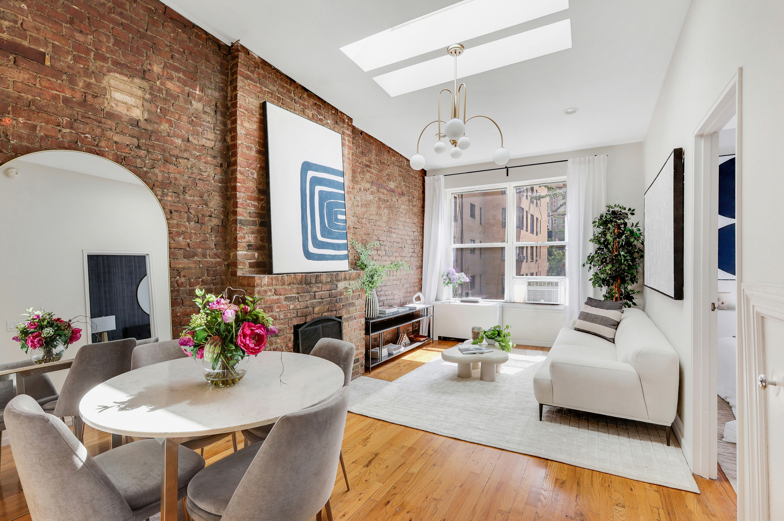 304 West 88th Street, Unit 4B Manhattan, NY 10024 - Photo 2 of 8 a living room with furniture and a potted plant