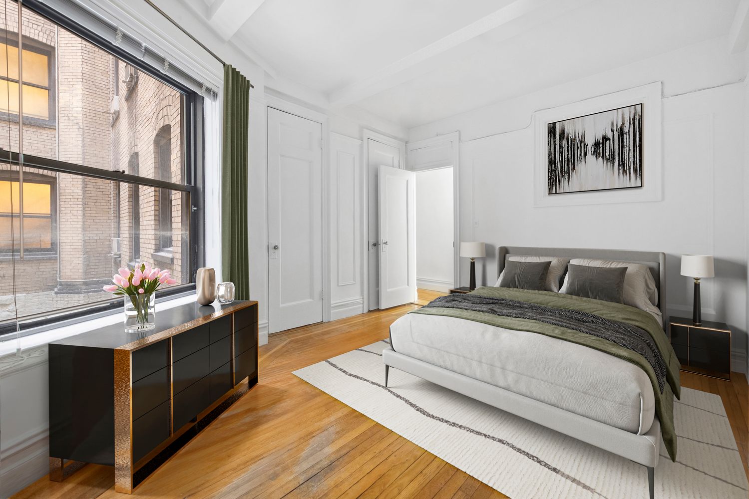 a spacious bedroom with a bed and a large window