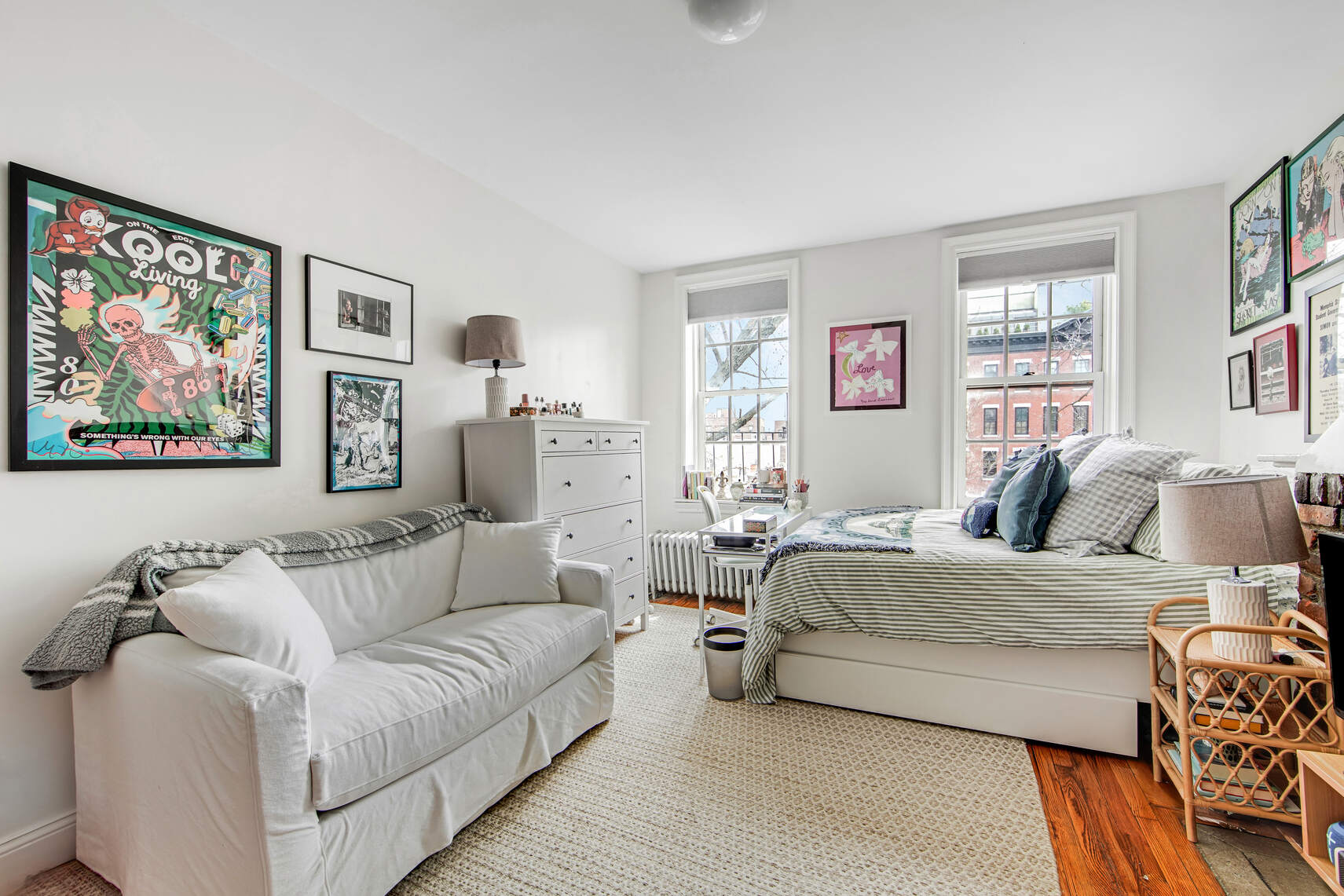 352 West 12th Street, Unit 5D Manhattan, NY 10014 - Photo 2 of 11 a living room with furniture and a large window