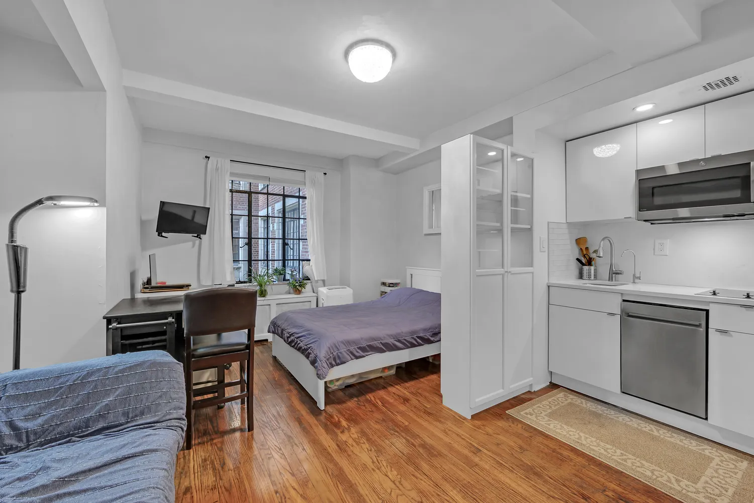 a bedroom with a bed and furniture