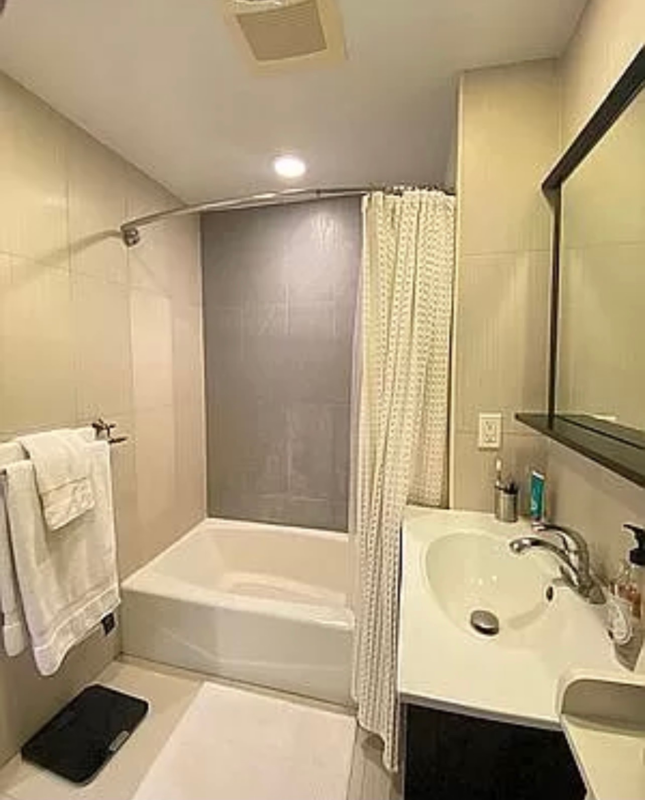 456 West 167th Street, Unit 6C Manhattan, NY 10032 - Photo 8 of 11 a bathroom with a tub sink and a mirror