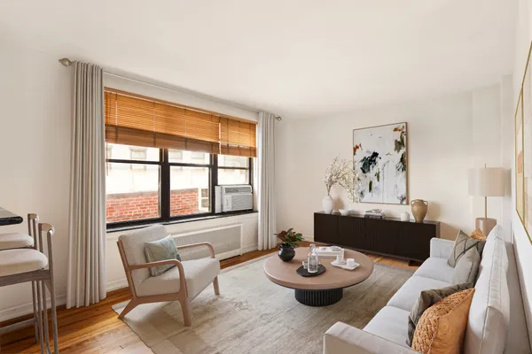 a living room with furniture and a window