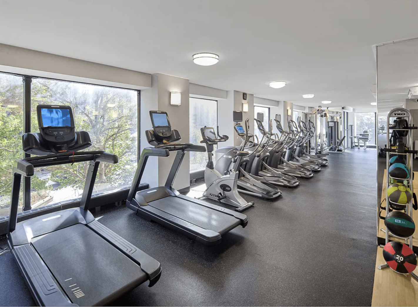 40 Harrison Street, Unit 24H Manhattan, NY 10013 - Photo 7 of 17 a view of a room with gym equipment