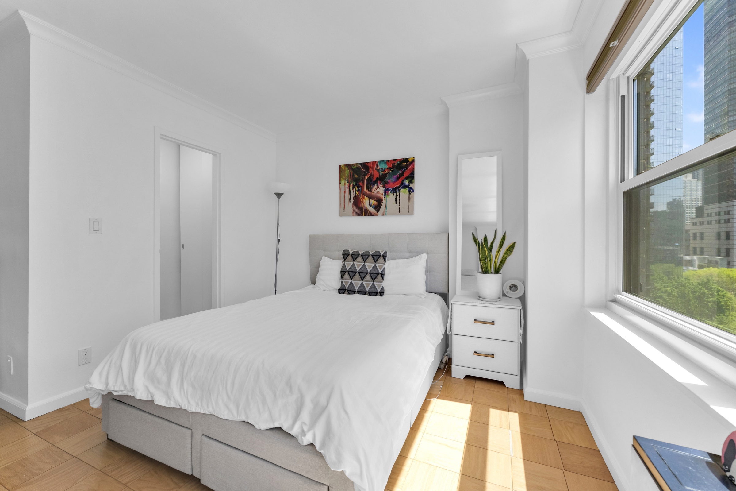 150 West End Avenue, Unit 10P Manhattan, NY 10023 - Photo 4 of 17 a spacious bedroom with a bed and a window