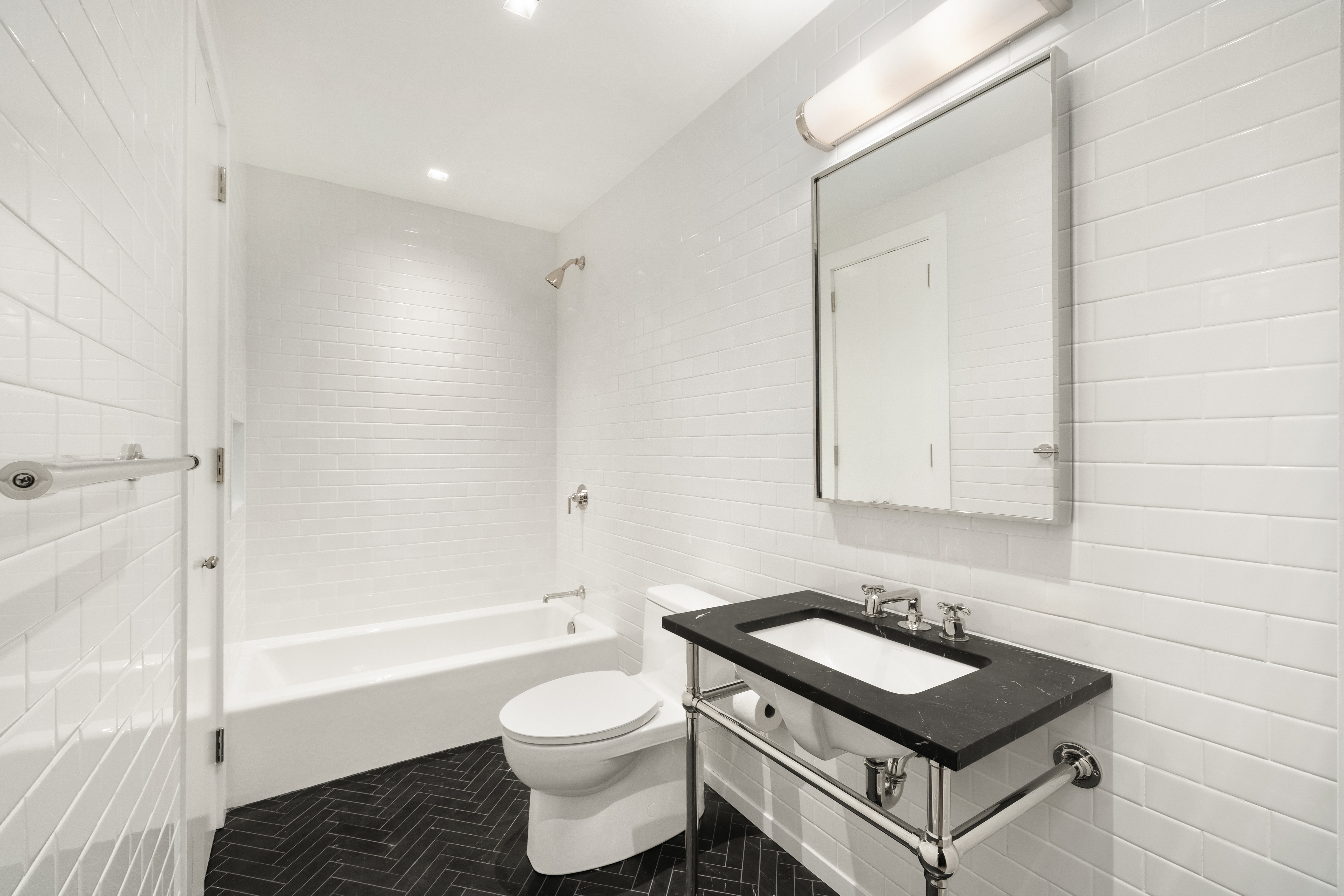 243 West Broadway, Unit 4 Manhattan, NY 10013 - Photo 10 of 12 a bathroom with a sink toilet and shower