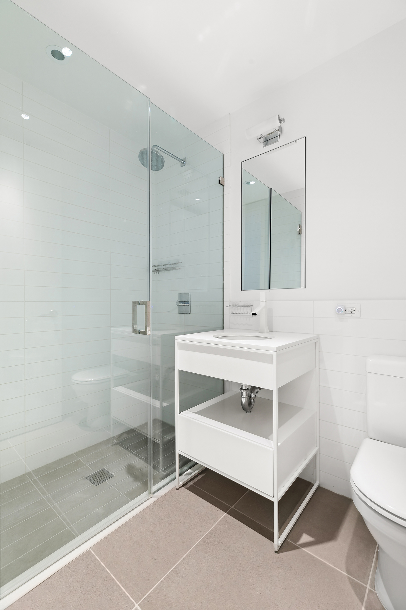 241 5th Avenue, Unit 4B Manhattan, NY 10016 - Photo 9 of 12 a bathroom with a sink a toilet and shower