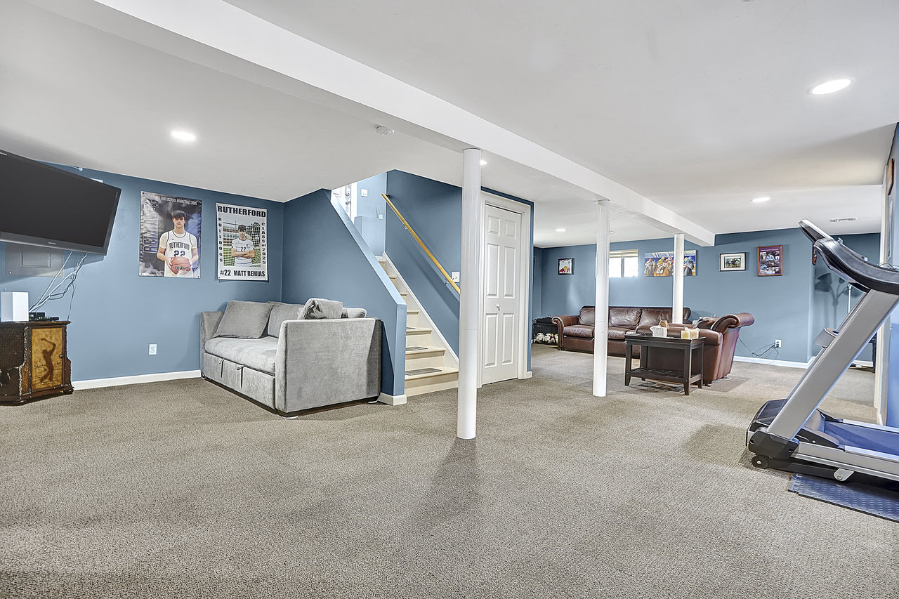 266 Feronia Way Rutherford, NJ 07070 - Photo 34 of 41 a living room with furniture and a flat screen tv
