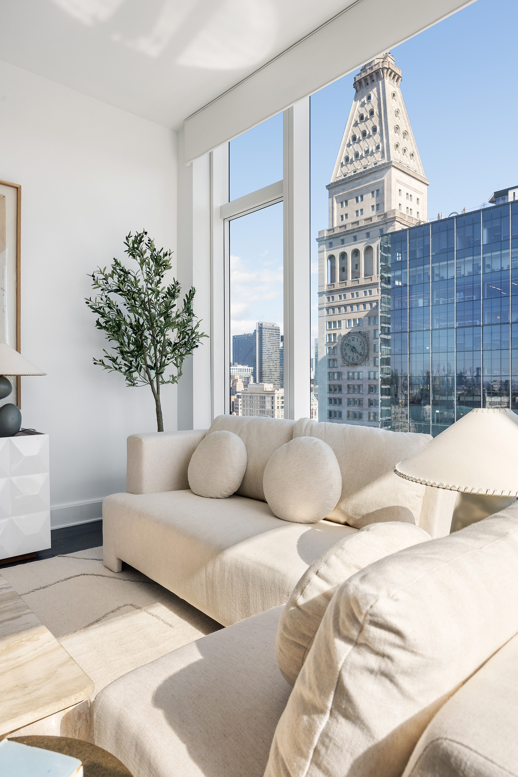 45 East 22nd Street, Unit 32B Manhattan, NY 10010 - Photo 10 of 36 a living room with furniture and a large window