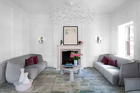 a living room with furniture window and a fireplace