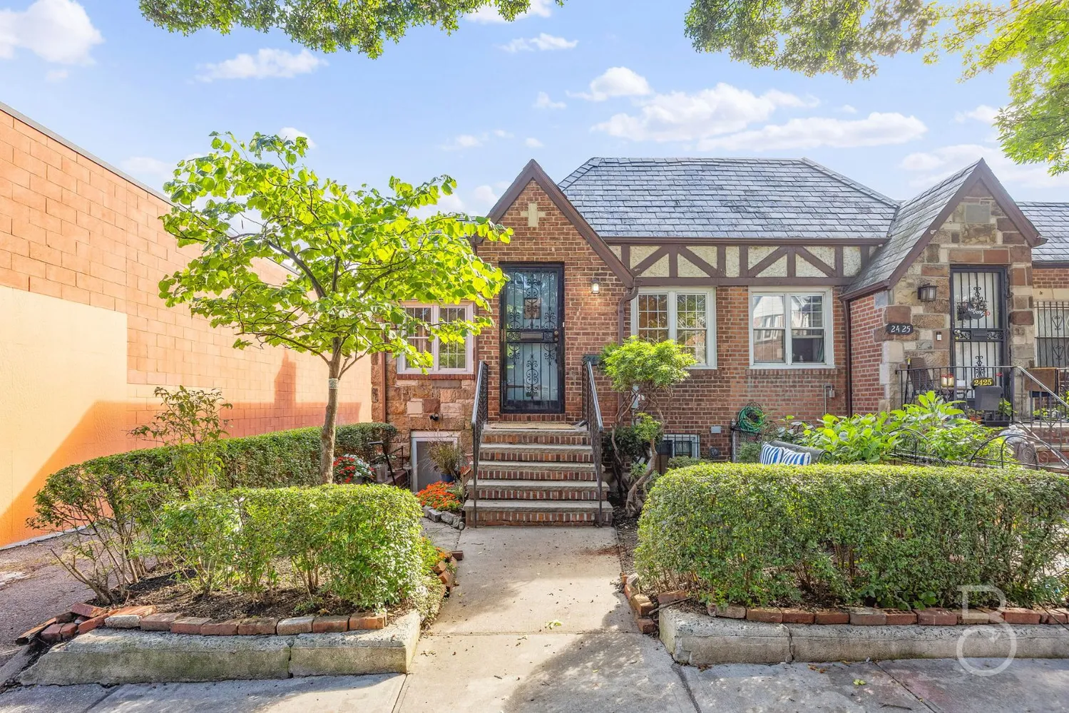 a front view of a house with garden