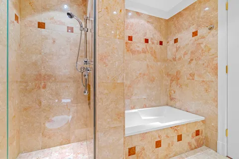 a bathroom with a shower and a sink